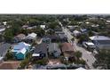 This aerial view showcases a neighborhood filled with tree-lined streets and charming bungalow-style homes at 2904 Sanchez St, Tampa, FL 33605
