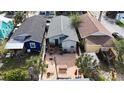 This backyard features a spacious brick patio and deck, perfect for outdoor entertaining at 2904 Sanchez St, Tampa, FL 33605