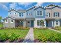 Charming townhomes with inviting patios and landscaped walkways under a beautiful blue sky at 17382 Alderwood Ln, Punta Gorda, FL 33982