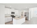 Modern kitchen features granite countertops, stainless steel appliances, and bright white cabinets at 3544 Moscato Dr, Brooksville, FL 34602
