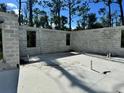 Concrete foundation with cinder block walls showing window placement for new home construction at 18141 Spartonvail Ave, Port Charlotte, FL 33954