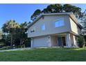 Exterior elevation of home with a blue front door at 1300 Pleasant S Way, St Petersburg, FL 33705