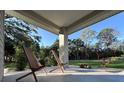 Covered front patio with modern chairs at 1300 Pleasant S Way, St Petersburg, FL 33705
