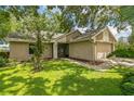 Traditional home with a well-maintained lawn and a two-car garage, perfect for comfortable suburban living at 2002 Culpepper Dr, Brandon, FL 33511