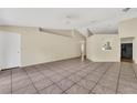 Bright, open living area featuring neutral walls, tile flooring, and access to kitchen area at 1236 Sweet Gum Dr, Brandon, FL 33511