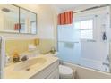 Bright bathroom featuring a shower-tub combo and a vanity sink at 8490 7Th Ln N,, St Petersburg, FL 33702