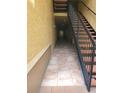 Hallway with tile flooring, leading to stairwell access at 4307 Bayside Village Dr # 103, Tampa, FL 33615