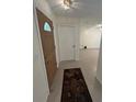 Light and airy foyer with tile flooring that transitions into an open floor plan at 9504 W Cluster Ave, Tampa, FL 33615