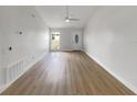 Bright and airy living room with sleek ceiling fan and modern flooring at 4506 Shadberry Dr, Tampa, FL 33624