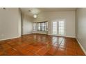 Bright living room featuring tile flooring, bay window, and access to the backyard at 3703 43Rd W Ave, Bradenton, FL 34205