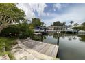 Waterfront property featuring a private dock with boat lifts and canal access at 568 Venice Ln, Sarasota, FL 34242