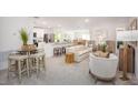 Bright, open-concept living space with modern furnishings and an inviting atmosphere at 12368 Piping Plover Ave, Weeki Wachee, FL 34614
