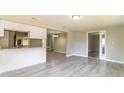 Open-concept living space with updated flooring and neutral color palette at 8744 Candlewick Ln, Port Richey, FL 34668