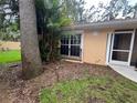 Exterior view of the home with lush landscaping and a well-maintained lawn at 131 49Th E Ct, Palmetto, FL 34221