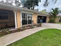 Side angle showing the home's exterior, garage, and lawn at 131 49Th E Ct, Palmetto, FL 34221