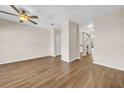 Bright, open living space featuring hardwood floors and neutral walls at 5857 Fishhawk Ridge Dr, Lithia, FL 33547