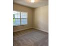 Spacious bedroom with large window and plush carpeting at 3481 Nashville Rd, North Port, FL 34288