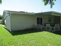 Relax on the covered patio overlooking the spacious backyard, ideal for Gathering gatherings at 4469 Keyes Ave, Spring Hill, FL 34606
