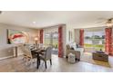 Bright dining area with water views and sliders to patio at 8213 County Line Rd, Spring Hill, FL 34606