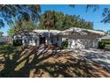 Single-story home with attached garage and mature landscaping at 15123 Copeland Way, Spring Hill, FL 34604