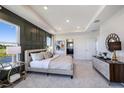 Main bedroom with water views and a stylish, dark-colored accent wall at 7479 Rome Ln, Brooksville, FL 34613