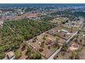 An aerial shot showing the property, outbuildings, and the surrounding landscape at 8279 Sunshine Grove Rd, Brooksville, FL 34613