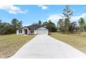 Charming single-Gathering home with a well-maintained lawn and an extra long concrete driveway at 14183 English Sparrow Rd, Weeki Wachee, FL 34614