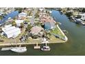 Waterfront property on a canal with a private dock, tropical landscaping, and boat access at 4446 Bahama Dr, Hernando Beach, FL 34607