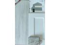 Selection of interior design elements including flooring, cabinet door, paint swatches, and countertop sample at 13187 Gulf Bay Ln, Spring Hill, FL 34609