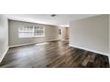 Open-concept living area featuring new flooring and windows, providing an abundance of natural light at 2140 N Bay Hills Blvd, Safety Harbor, FL 34695