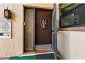 Charming condo front door featuring a decorative wreath and adjacent window at 2756 Clubhouse Dr # 101, Sarasota, FL 34232