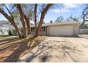 This charming home features an attached two-car garage and a driveway offering ample parking at 7105 N Whittier St, Tampa, FL 33617