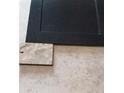 Close up of flooring and cabinet door, showing the material for a kitchen or bathroom at 13362 Quigley Ave, Weeki Wachee, FL 34614