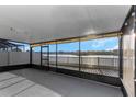 Relaxing screened patio with lake view, featuring ample space and serene surroundings at 1739 Broad Winged Hawk Dr, Ruskin, FL 33570