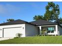 Beautiful single-story home with a two-car garage and attractive landscaping at 2370 Allsup Ter, North Port, FL 34286