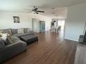 Comfortable living room flowing into the dining area, featuring a plush sectional sofa at 8343 Fantasia Park Way, Riverview, FL 33578