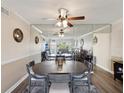 Elegant dining room with a large table and mirrored wall creating a spacious feel at 2401 Ecuadorian Way # 45, Clearwater, FL 33763