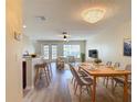 Bright, open living space with modern light fixtures, and a dining area with seating at 4510 Limerick Dr, Tampa, FL 33610
