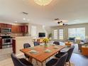 Open-concept living and dining area featuring modern decor and a seamless flow into the kitchen at 4510 Limerick Dr, Tampa, FL 33610
