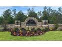 Waterford community sign surrounded by lush landscaping and green lawn at 11771 Memorial Dr, Brooksville, FL 34613