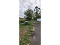 Community space showcasing a picnic table next to a walking path amidst a grassy landscape at 5469 Ocean Breeze Dr, Spring Hill, FL 34609