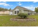 Well-maintained home with green siding, tidy landscaping, and an inviting yard at 14150 Prospect St, Spring Hill, FL 34609