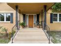 Inviting front porch with decorative iron details and a freshly painted front door at 39 Sunset Dr, Brooksville, FL 34601