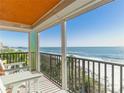 Spacious balcony overlooking the ocean with seating for relaxation at 15316 Gulf Blvd # 301, Madeira Beach, FL 33708
