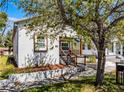 Charming stucco home with a cozy front porch and well-maintained landscaping at 2335 W Beach St, Tampa, FL 33607