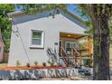 Charming stucco home with a cozy front porch and well-maintained landscaping at 2335 W Beach St, Tampa, FL 33607