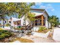 Charming stucco home with a cozy front porch and well-maintained landscaping at 2335 W Beach St, Tampa, FL 33607