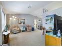 Living room with two armchairs, a TV, and a fireplace at 3039 Bigelow Dr, Holiday, FL 34691