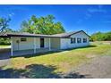 Well-maintained exterior with covered patio and large backyard at 3212 Cork Rd, Plant City, FL 33565