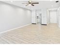 Bright living room featuring tile floors, a ceiling fan, and neutral paint at 1433 S Belcher Rd # G13, Clearwater, FL 33764